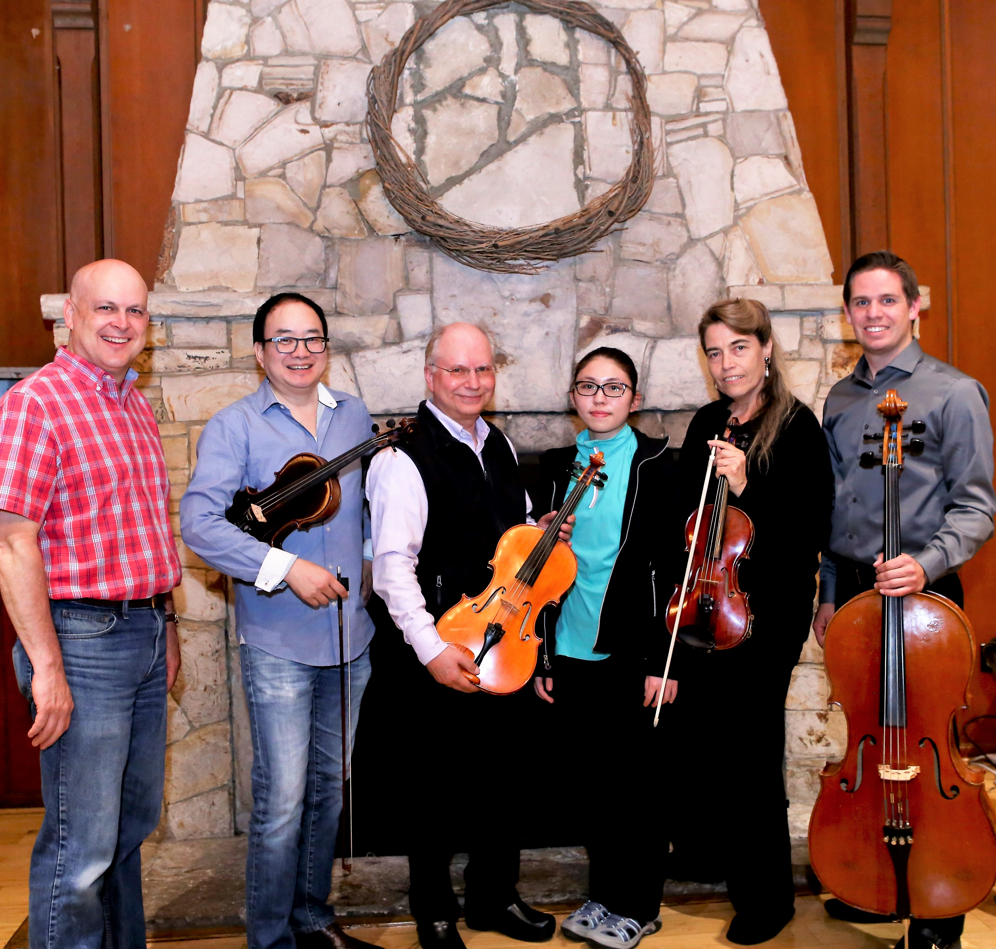 CRANDL Chamber Group musicians together with their string instruments